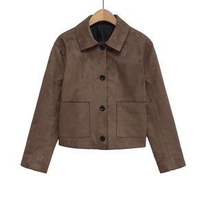 Close-up of brown faux suede jacket detail showing lapel collar and black buttons