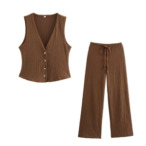 Detailed texture of brown V-neck buttoned vest and matching drawstring trousers set