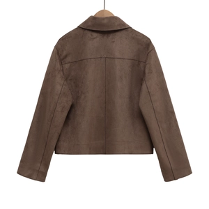 Back view of a cropped faux suede moto jacket in dark brown hanging on a wooden hanger