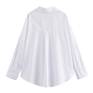 Rear view of a white long sleeve shirt with back pleat and curved hem detail