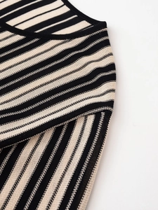 Detailed macro view of the black and white striped knit fabric texture and fine stitching