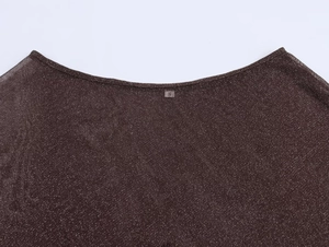 Close-up of brown metallic knit top neckline with sparkling silver threads and size S label