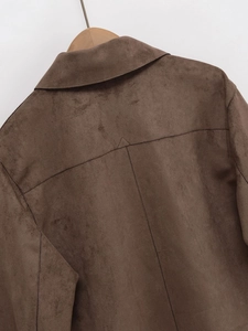 Detail of the back and collar of a dark brown faux suede biker jacket for women