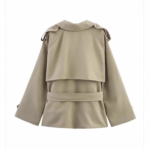 Back view of a khaki women's short trench coat with waist belt and shoulder epaulettes