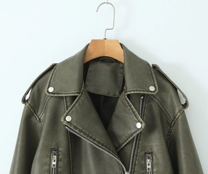 Detail of vintage army green faux leather jacket with metal zipper and notched lapels