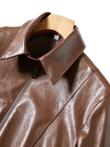 Women's short faux leather jacket in dark brown featuring a classic lapel and metal zipper