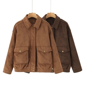 Detailed view of suede bomber jacket in camel and brown with buttoned flap pockets