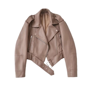 Flat lay detail of a dusty pink faux leather biker jacket with collar and belt