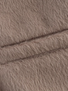 Macro shot showing the soft fuzzy texture of the pink faux wool jacket for women