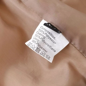 Detail of care label showing 100% polyurethane coating and polyester lining fabric