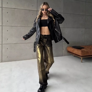 Fashionable black leather jacket styled with metallic wide-leg trousers for a chic street look