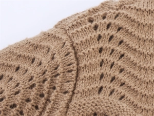 Detailed close-up showing intricate hollow knit texture and soft khaki yarn craftsmanship