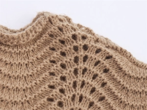 Detailed close-up of wavy knit texture and fuzzy mohair fabric on a brown sweater