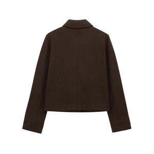 Detail view of the back of a brown wool jacket showing refined stitching and clean hemline