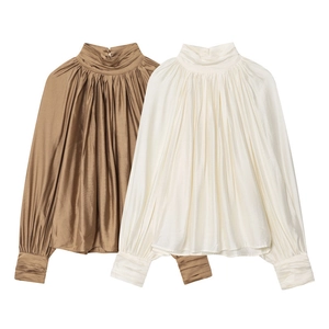 Elegant high-neck long sleeve shirts in bronze and off-white silk satin with ruched details