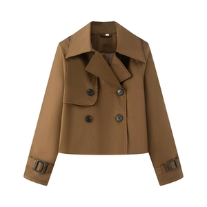 Detail of brown double-breasted cropped trench coat with large lapels and black buttons