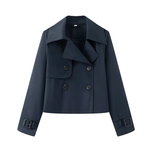 Flat lay of a navy blue double-breasted cropped trench coat with wide lapels and cuff straps