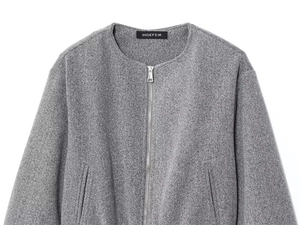 Detailed view of grey textured bomber jacket with round neck and metal zipper closure