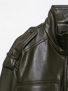 Detail of dark olive green leather jacket showing shoulder epaulettes and stand collar