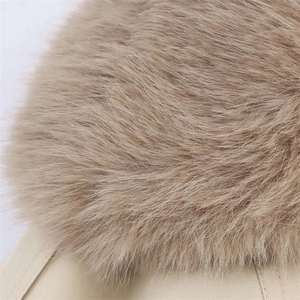 Detailed macro view of soft fluffy faux fur collar on a beige twill jacket