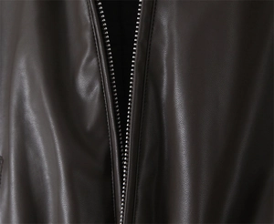 Close-up of the silver metal zipper on the brown vintage leather puffer jacket