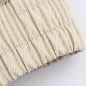 Macro shot of elastic waistband with parallel stitching on beige twill jacket