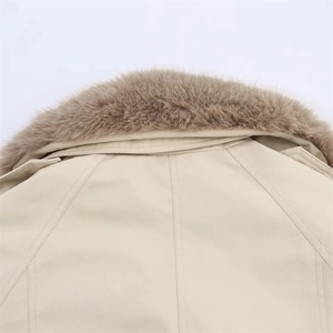 Detail of soft faux fur collar and premium twill fabric on beige parkas jacket
