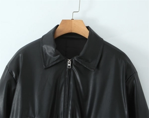 Close-up of vintage brown padded leather jacket with zipper and quilted lining