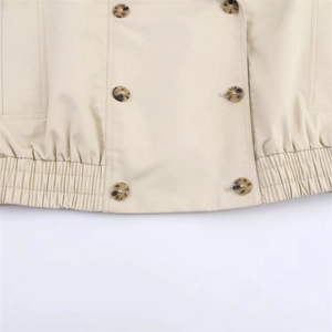 Short khaki double-breasted jacket with elastic hem and stylish tortoiseshell buttons