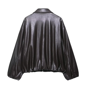 Back view of a vintage faux leather bomber jacket showing premium grain and ribbed hem