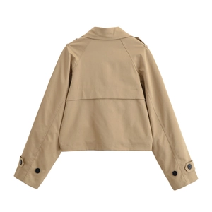 Rear view of tan cropped trench coat with storm flap and buttoned shoulder epaulettes