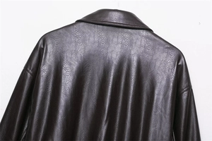 Close-up of the back showing dark brown faux leather texture and vintage collar detail