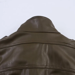 Detail shot of the stand collar and stitching on the olive green faux leather jacket
