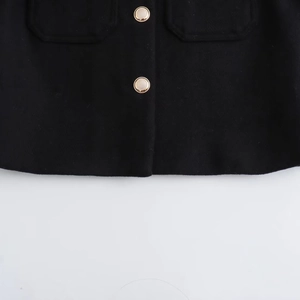 Women's black trench jacket featuring elegant gold metal buttons and lapel pocket detail