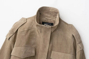 Detail of khaki faux suede jacket with windproof stand collar and shoulder epaulettes