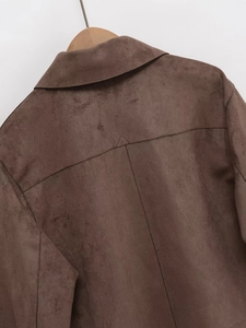 Detailed back view of dark brown suede jacket showing high-quality stitching and texture