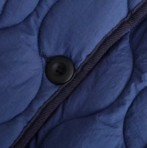 Deep blue wavy quilted cotton jacket with high-quality zipper and button details