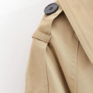 Classic khaki trench coat shoulder detail with epaulet and premium twill fabric texture