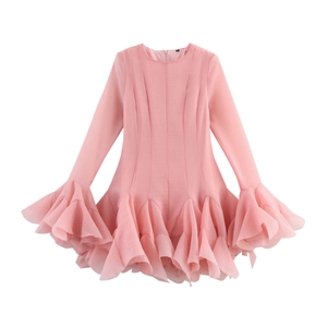 Detailed view of layered ruffle hem and sleeve on pink long sleeve dress