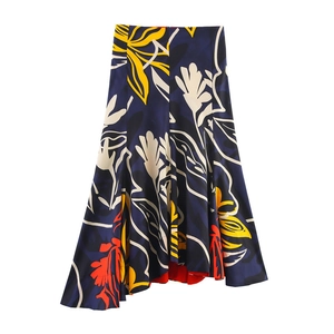 Flat lay detail of deep blue A-line maxi skirt with bold yellow and white floral prints