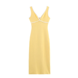 Detail of deep V-neckline with white lace trim on a yellow sleeveless midi dress