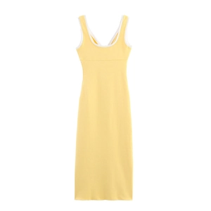 Detailed close-up of yellow bodycon dress with delicate white lace trim on neckline