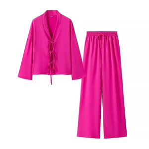 Women's two-piece magenta lounge set with tie-front long sleeve top and wide-leg pants