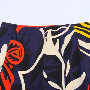 Detail view of high waist skirt with abstract art print and seamless invisible zipper