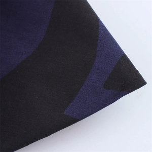 Macro view of high-density navy and black geometric twill fabric with diagonal texture