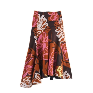 Detail of high waist A-line midi skirt with colorful floral print and irregular hem
