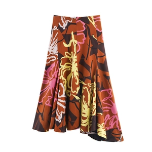 Detail of high-waisted floral skirt featuring irregular hem and abstract artistic print