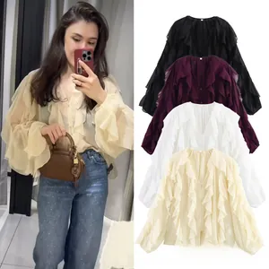 Detail view of ruffled tiered long sleeve chiffon blouse with V-neck in multiple colors