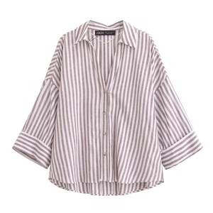 Detail of taupe and white striped shirt collar with V-neck and button placket detail