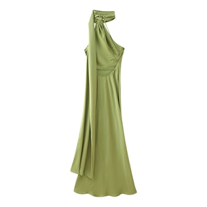 Detail of elegant avocado green satin maxi dress with halter neck and long streamers
